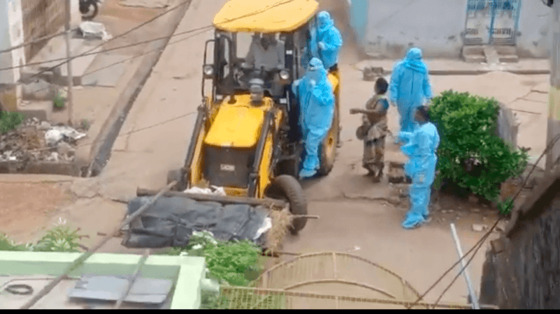 70-year-old COVID-19 victim's body transported in a JCB