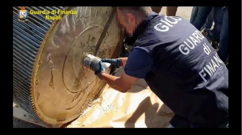 An Italian finance police officer opens a machinery containing ISIS produced amphetamine pills in Salerno, Italy. italian police