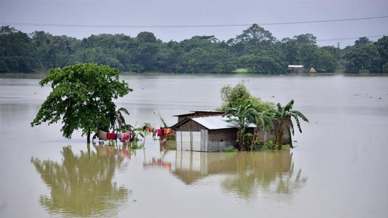 The water level of river Brahmaputra was above the danger level at Guwahati. floods in assam