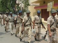 Personnel of Maharashtra State Reserve Police Force conduct a flag march ahead of 2014 Lok Sabha Election in Bangalore on April 1, 2014. (Photo: IANS)