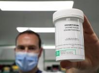 FILE PHOTO: A pharmacist displays a box of Dexamethasone at the Erasme Hospital amid the coronavirus disease (COVID-19) outbreak, in Brussels, Belgium, June 16, 2020. REUTERS
