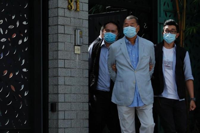 Media mogul Jimmy Lai Chee-ying, founder of Apple Daily (C) is detained by the national security unit in Hong Kong, China August 10, 2020. REUTERS/Tyrone Siu Media mogul Jimmy Lai Chee-ying, founder of Apple Daily (C) is detained by the national security unit in Hong Kong, China August 10, 2020. REUTERS/Tyrone Siu