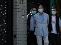Media mogul Jimmy Lai Chee-ying, founder of Apple Daily (C) is detained by the national security unit in Hong Kong, China August 10, 2020. REUTERS/Tyrone Siu