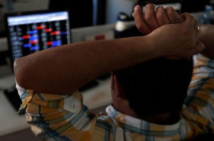 A broker reacts while trading at his computer terminal at a stock brokerage firm in Mumbai, India, February 1, 2020. REUTERS/Francis Mascarenhas/Files India's equity mutual funds show first outflows in more than four years