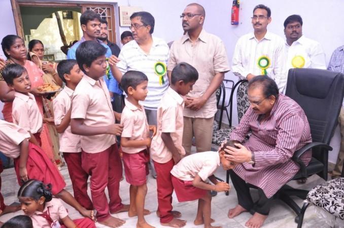 Children seeking the blessings of SP Balasubrahmanyam. SPB at Raghava Lawrence's orphanage