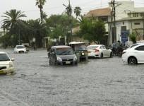 Karachi (Pakistan), July 6, 2020 (Xinhua) -- Vehicles run through a flooded road in the heavy monsoon rain in southern Pakistani port city of Karachi, on July 6, 2020