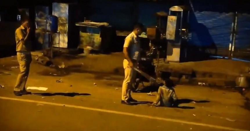 Screengrab from viral clip of Delhi cop assaulting minor boy Screengrab from viral clip of Delhi cop assaulting minor boy