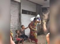 Screengrab from viral video of woman being manhandled