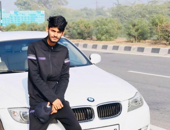 Farmer boy posing with his Beamer Farmer boy posing with his Beamer