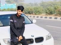 Farmer boy posing with his Beamer