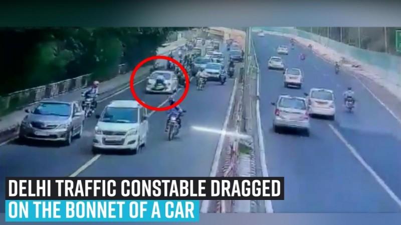 Delhi Traffic constable dragged on the bonnet of a car for 400 metres