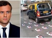 Posters of Emmanuel Macron stuck on Bhendi Bazaar road.