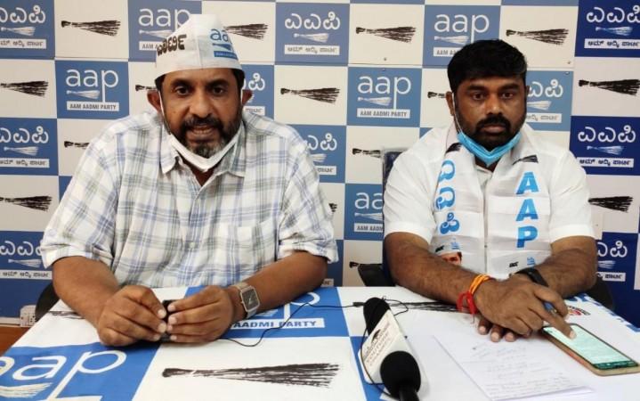Karnataka AAP convener Prithvi Reddy (left) during a press conference AAP