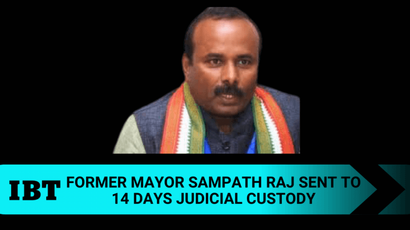 Former Mayor Sampath Raj has been sent to 14 days judicial custody in Bengaluru riots case. IBTimes creative. Former Mayor Sampath Raj has been sent to 14 days judicial custody in Bengaluru riots case.