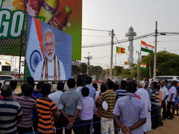 People in Jaffna watch the address of PM Modi at the launch of nationwide expansion of emergency ambulance service in 2018. Modi