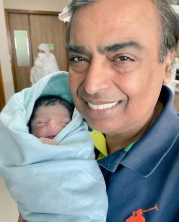 Mukesh Ambani holds grandson