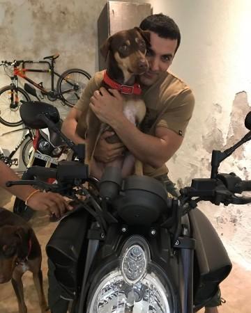 John loves dogs and bike