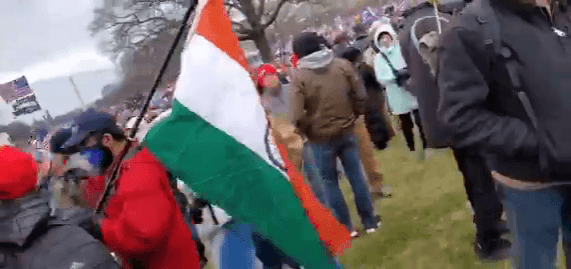In this photo, another man, Krishna Gudipati, is seen holding Indian national flag during US Capitol violence in Washington DC. Indian flag at US capitol