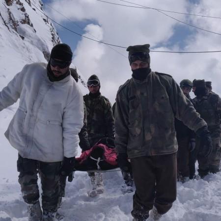 Indian Army rescuing civilians in an avalanche Indian Army