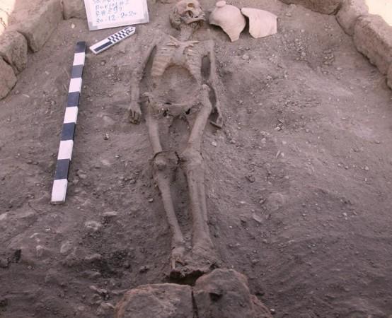 Burial of an individual with arms outstretched to his side, near Luxor, Egypt Egypt