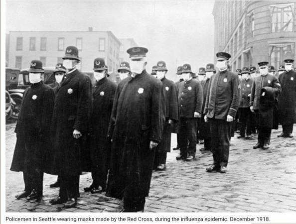 Policemen in Seattle, Washington, wearing protective masks made by the Seattle Chapter of the Red Cross, during the influenza epidemic in 1918 Spanish Flu