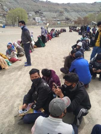 Locals waiting for their turn to purchase fresh vegetables, dates and other essential commodities at Kargil Locals waiting for their turn to purchase fresh vegetables, dates and other essential commodities at Kargil