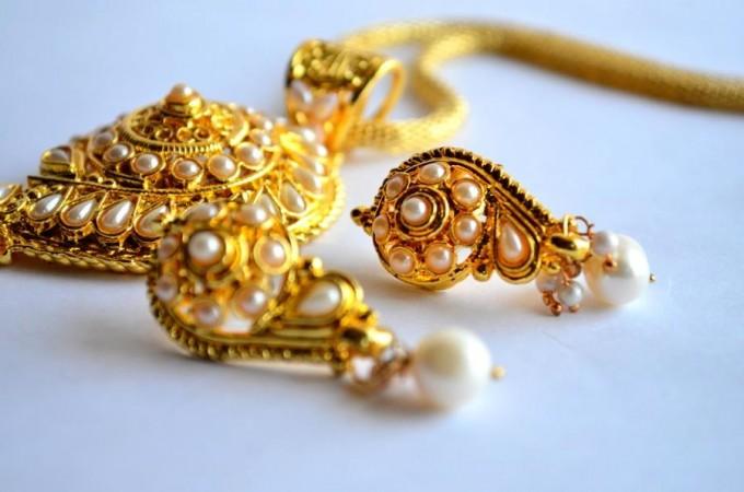 Representational image Gold earrings