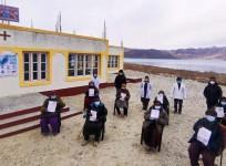 Locals showing certificates after getting second dose of vaccination in Ladakh