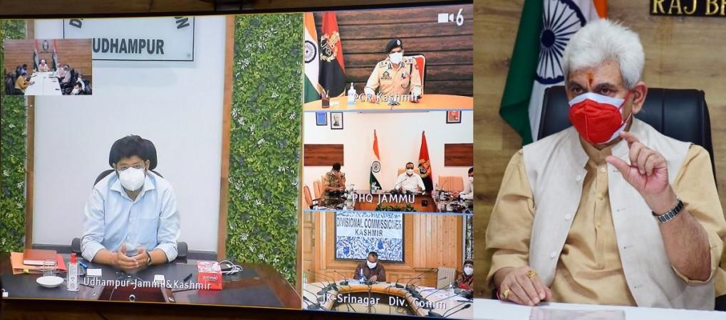 Lieutanant Governor of J&K Manoj Sinha discussing COVID prepardness with officers