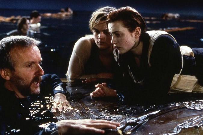 James Cameron with Kate Winslet and Leonardo DiCaprio during the filming of the iconic climax scene Titanic - working stills