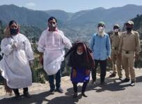 Team of Health Department after vaccinating 120-year-old Dholi Devi