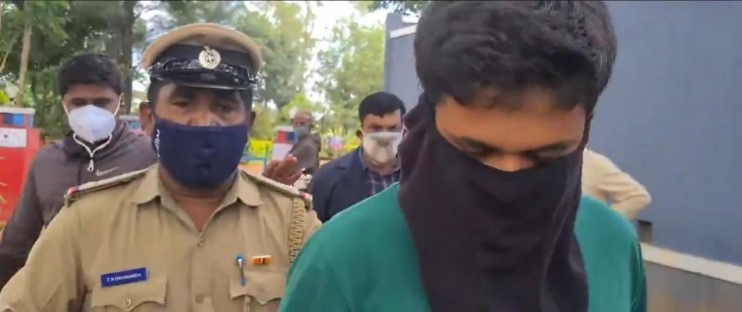 A video grab shows Madikeri police official manhandling the reporter A video grab shows Madikeri police official manhandling the reporter