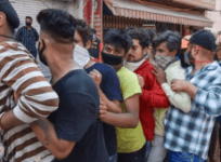 Physical distancing go for a toss, uncontrolled rush of people outside a wine shop in Jammu
