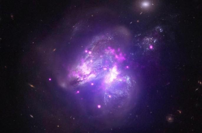 Two galaxies merging together Galaxies merging