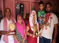 Caption: Karate champ Hari Om Shukla (extreme right) now sells tea.