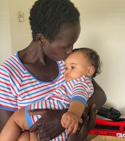 Marathoner Aliphine Tuliamuk with baby Zoe Marathoner Aliphine Tuliamuk with baby Zoe