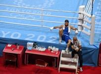 French boxer disqualified for headbutt, sits on ringside in protest
