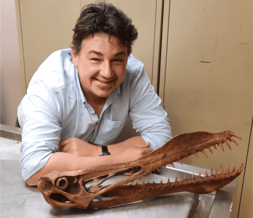 Tim Richards with the skull of an anhanguerian pterosaur. tim Richards