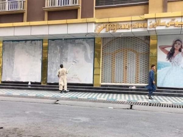 Bridal dress ads in Kabul covered in white paint