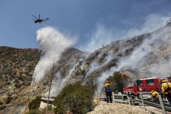 A firefighter is on duty in an area hit by a wildfire dubbed Dixie Fire in Butte County, Northern California, the United States, Aug. 5, 2021. (Photo by Dong Xudong/Xinhua/IANS) wildfire