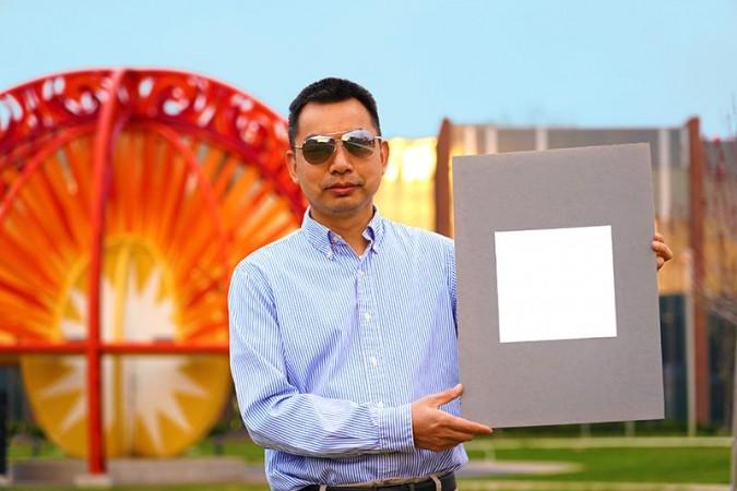 Xiulin Ruan, a Purdue University professor of mechanical engineering, holds up his lab's sample of the whitest paint on record White paint