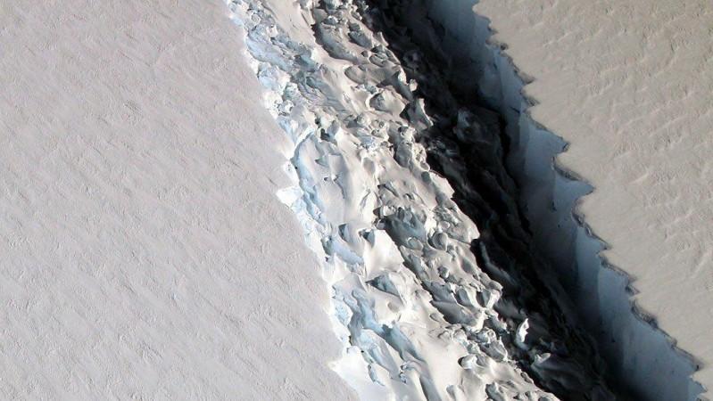 This 2016 photo shows a rift that, within a few months, widened even farther and and released a Delaware-size iceberg from Antarctica's Larsen C ice shelf. The rough surface of ice mélange is visible on one side of the rift. Credit: NASA/GSFC/OIB Melange