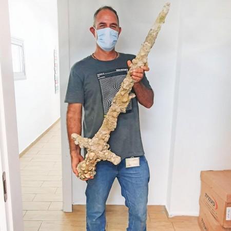 Shlomi Katzin with the 900-year-old sword Ancient sword