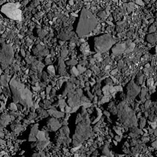 This image shows a view of asteroid Bennu's surface in a region near the equator. It was taken by the PolyCam camera on NASA's OSIRIS-REx spacecraft on March 21, 2019 from a distance of 2.2 miles (3.5 km). (Credits: NASA/Goddard/University of Arizona) Bennu