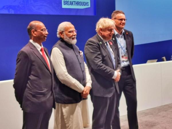 (L-R): Dr Ajay Mathur, Director General, The International Solar Alliance (ISA); Narendra Modi, Honorable Prime Minister of India; Mr Boris Johnson, Hon'ble Prime Minister of the United Kingdom, at the launch of Green Grids Initiative – One Sun One World One Grid (GGI-OSOWOG), at the World Leaders Summit - COP26 climate conference in Glasgow. (L-R): Dr Ajay Mathur, Director General, The International Solar Alliance (ISA); Shri Narendra Modi, Honorable Prime Minister of India; Mr Boris Johnson, Hon'ble Prime Minister of the United Kingdom, at the launch of Green Grids Initiative – One Sun One W