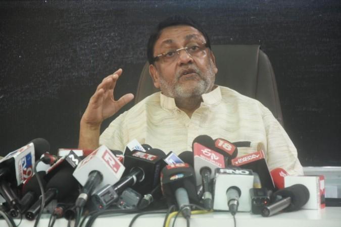 Nawab Malik in a file photo. IANS Mumbai: Maharashtra Minorities Minister Nawab Malik during a press conference on Cordelia Cruz Drugs NCB issues at Kurla in Mumbai on Sunday, November 07, 2021.