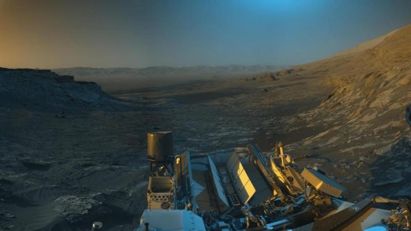 An artistic interpretation of Curiosity's view from NASA's Curiosity Mars rover's image that used its navigation cameras to capture panoramas of this scene. Blue, orange, and green color was added to a combination of the panoramas for an artistic interpretation of the scene. Curiosity picture postcard