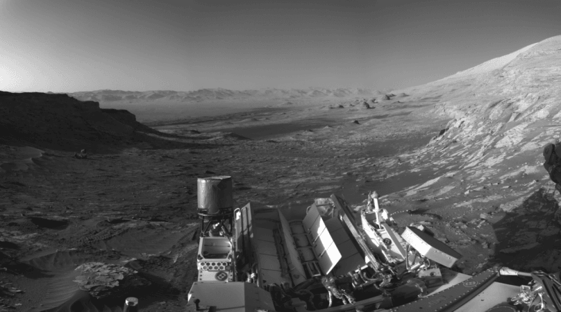 An artistic interpretation of Curiosity's view from NASA's Curiosity Mars rover's image that used its navigation cameras to capture panoramas of this scene. Blue, orange, and green color was added to a combination of the panoramas for an artistic interpretation of the scene. Curiostiy postcard