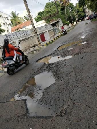 Potholes on Charles Campbell Road in September Charles Campbell Road in September