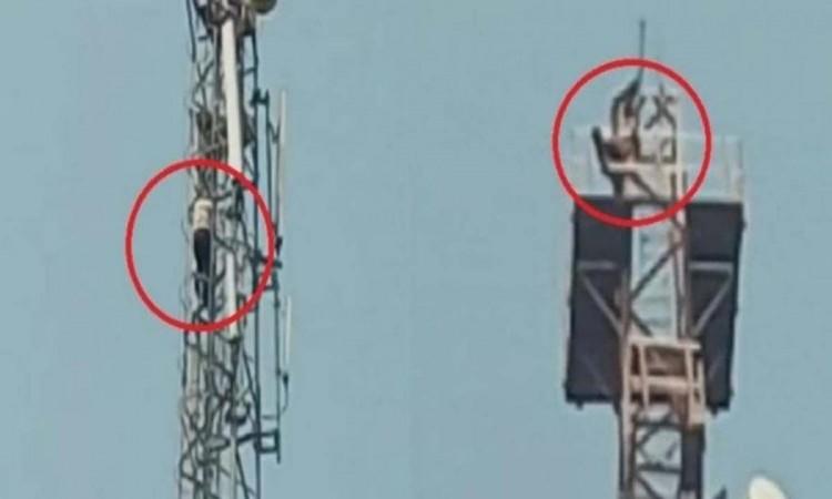 UP: Man climbs on tower with kids over wife's infidelity